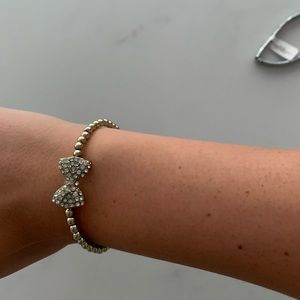 Gold bracelet with a diamond bow